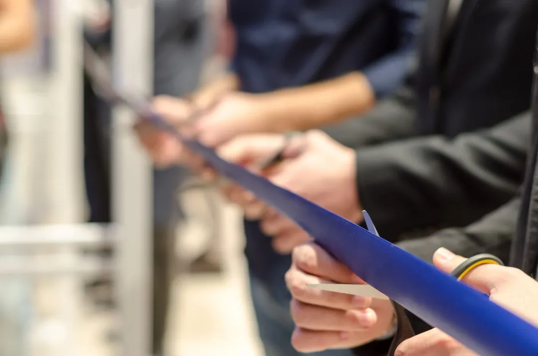 Ribbon being cut at a plant grand opening
