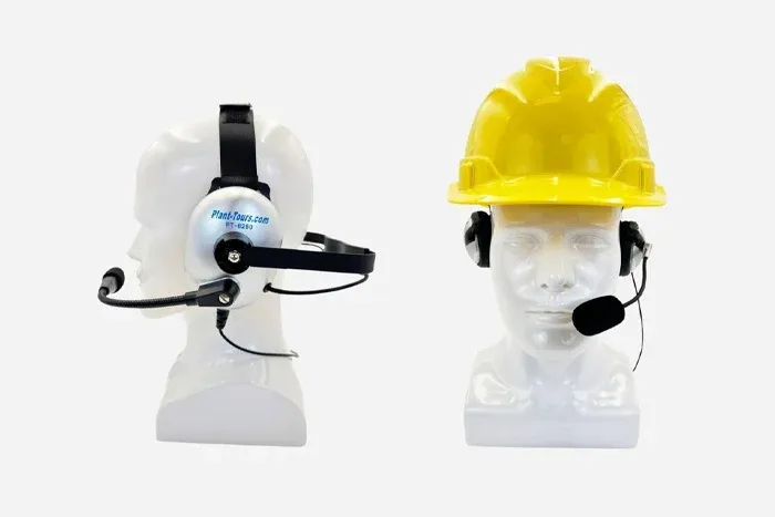 Behind-the-head headset with boom microphone on a mannequin, also shown worn with a hard hat