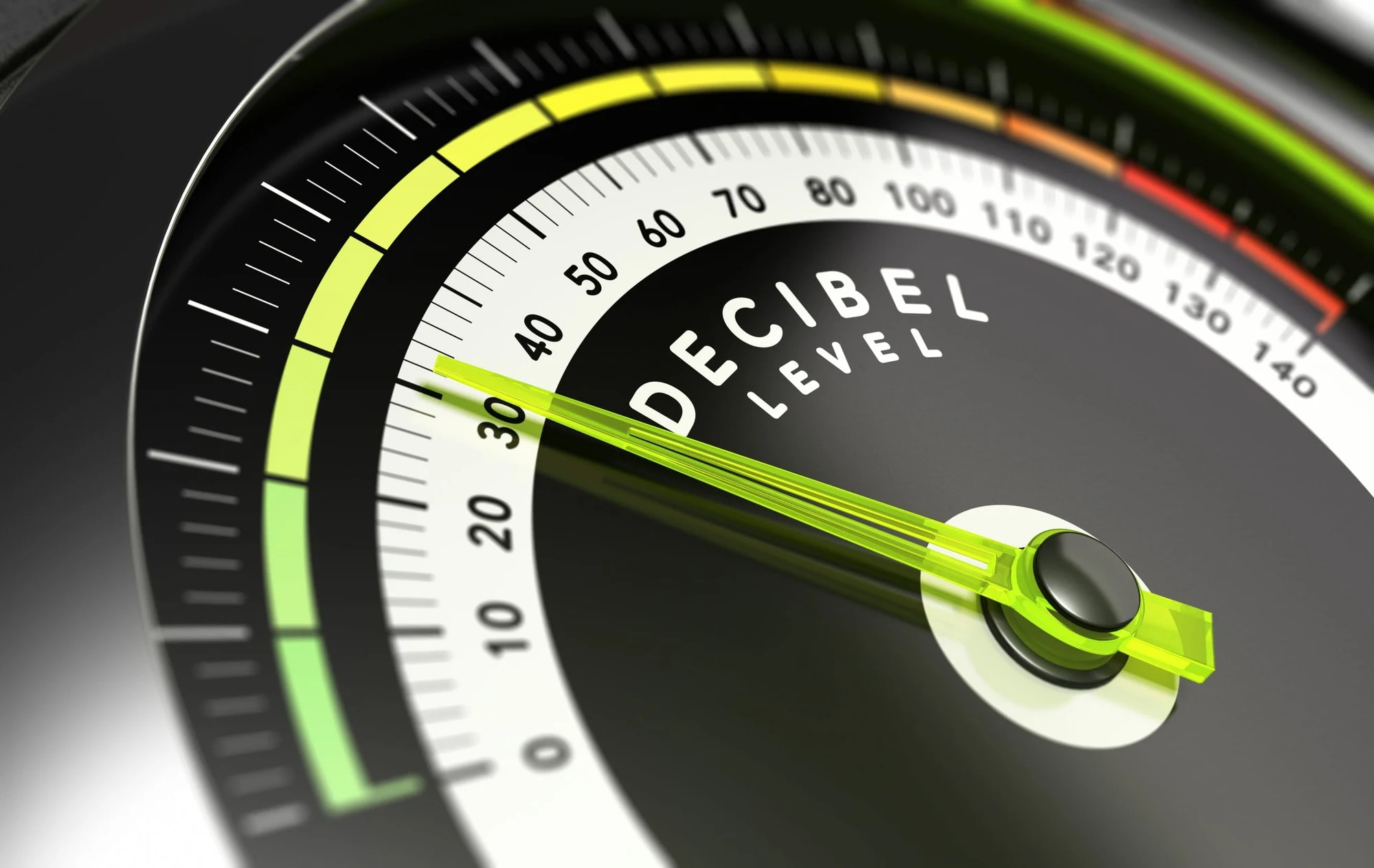 Close-up of a decibel level gauge with a green needle pointing near 35